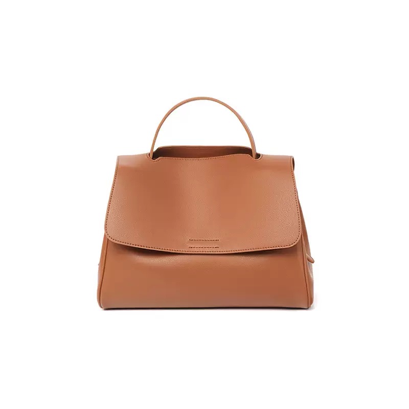 Leather bag care products and cleaning supplies arranged elegantly
