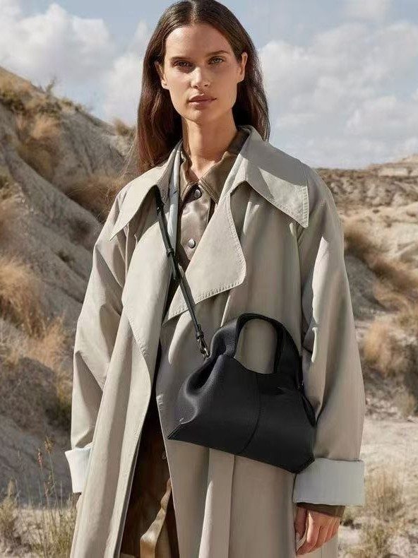 Cloud Dumpling Top-Handle Shoulder Bag in Black — side angle