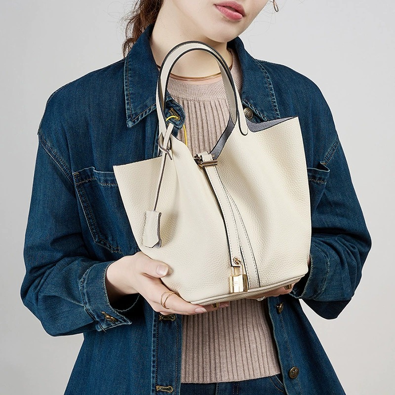 Cowhide Bucket Bag in Orange — side angle