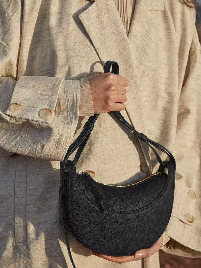 Crescent Saddle Shoulder Bag in Brown — side angle