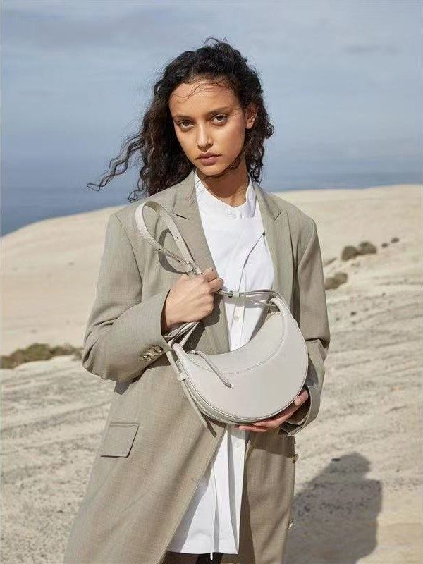 Crescent Saddle Shoulder Bag in Brown — back view