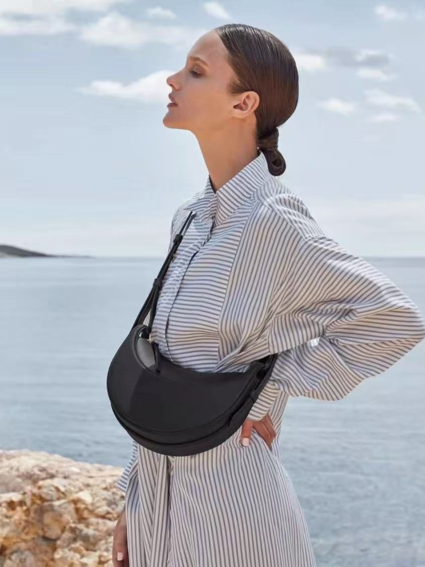 Crescent Saddle Shoulder Bag in Brown — detail close-up