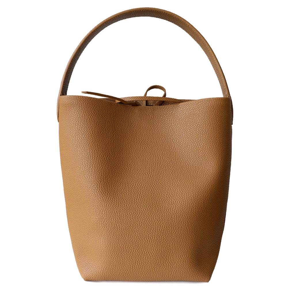 Japanese-Minimalist Leather Bucket Tote Bag in Black — worn on shoulder