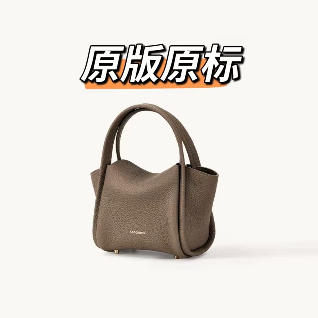 Leather Clutch Bag in Classic — worn on shoulder