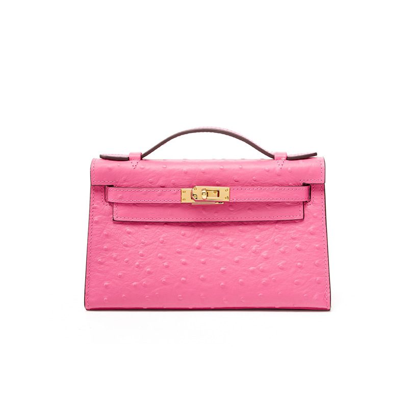 Ostrich-Embossed Top-Grain Leather Kelly Crossbody Bag in Pink — styling photo