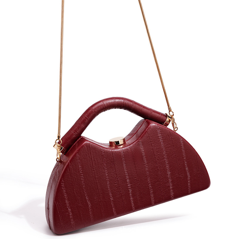 Satin Triangle Evening Clutch in Black — detail close-up