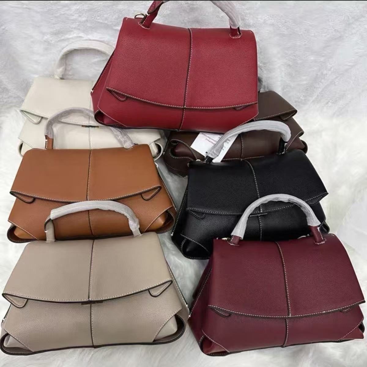 Smile Pleated Top-Handle Bag in Camel — side angle