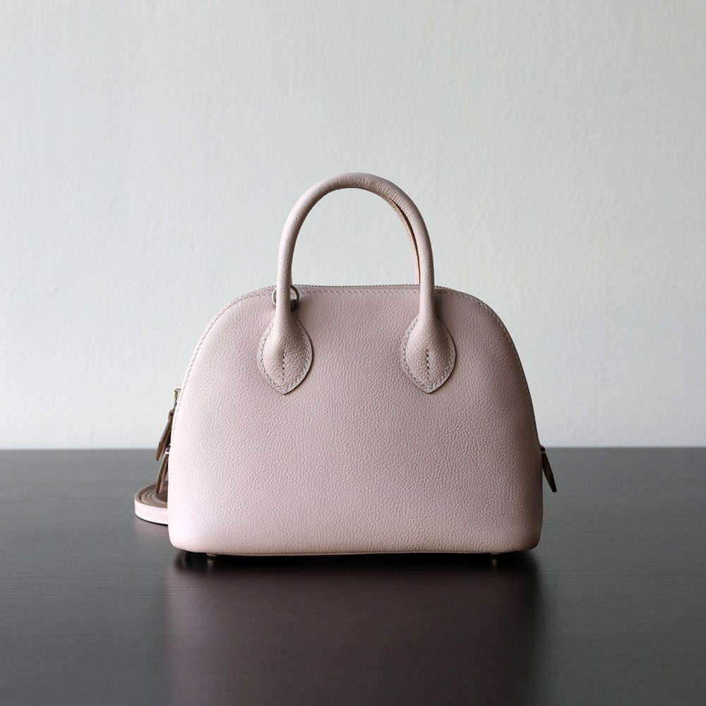 Top-Grain Cowhide Bolide Crossbody Bag in Ivory — worn on shoulder