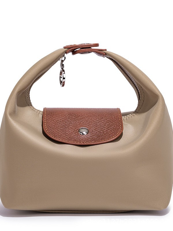 Waterproof Nylon Dumpling Shoulder Bag in Cream Yellow — front view