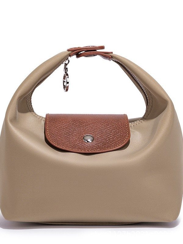 Waterproof Nylon Dumpling Shoulder Bag in Cream Yellow — front view
