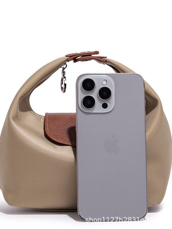 Waterproof Nylon Dumpling Shoulder Bag in Cream Yellow — side angle