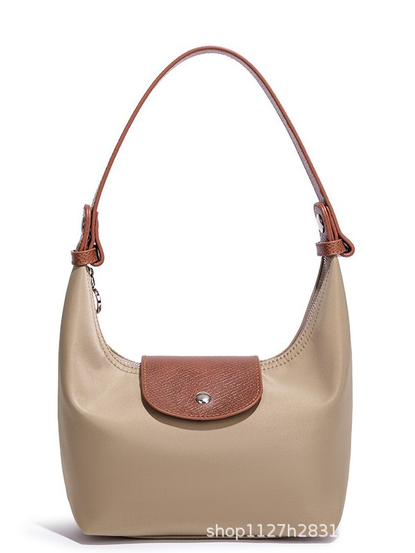 Waterproof Nylon Dumpling Shoulder Bag in Cream Yellow — interior view