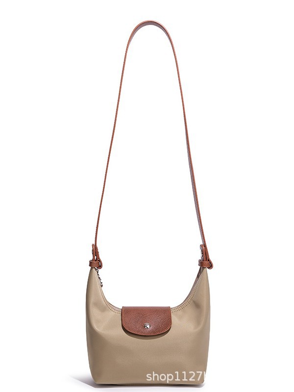 Waterproof Nylon Dumpling Shoulder Bag in Cream Yellow — detail close-up