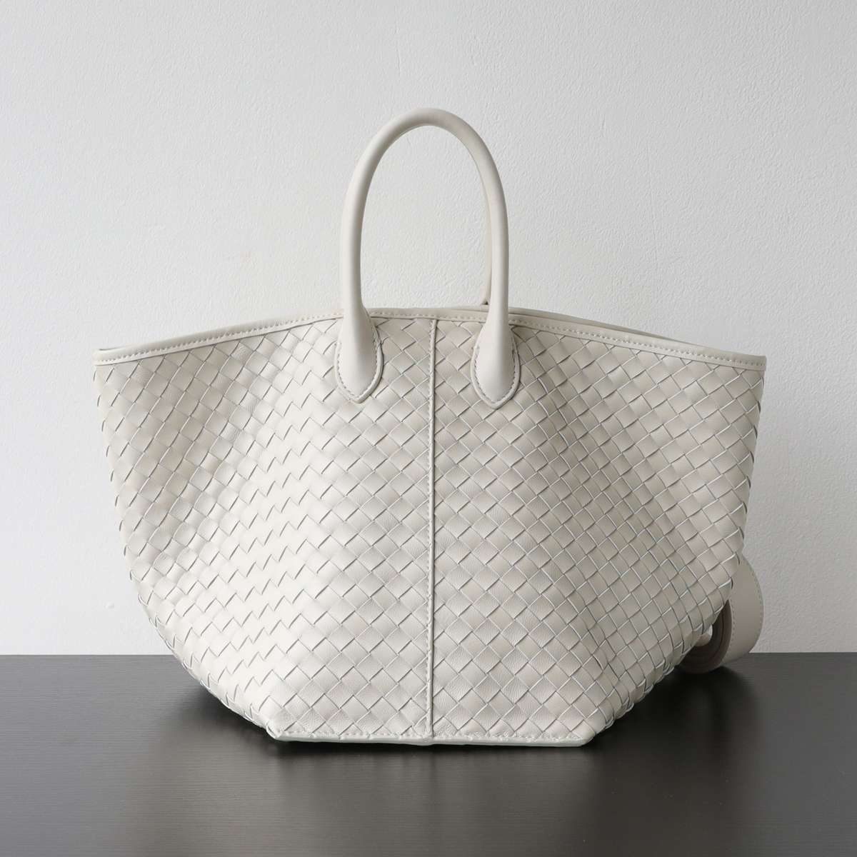 Woven Wing Leather Tote Bag in Beige — side angle